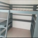 Top bed with bookshelf and toy shelves